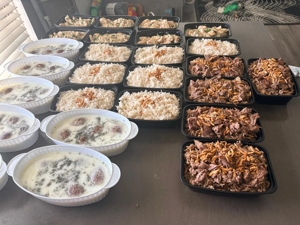 Many individual meals and family trays laid out together.